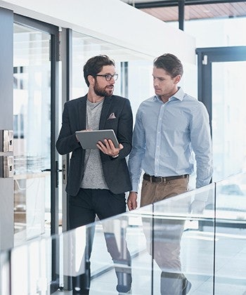 men looking into a tablet