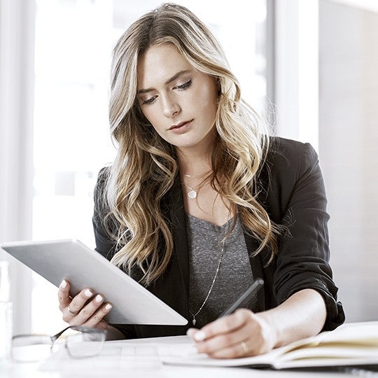 woman working with her tablet