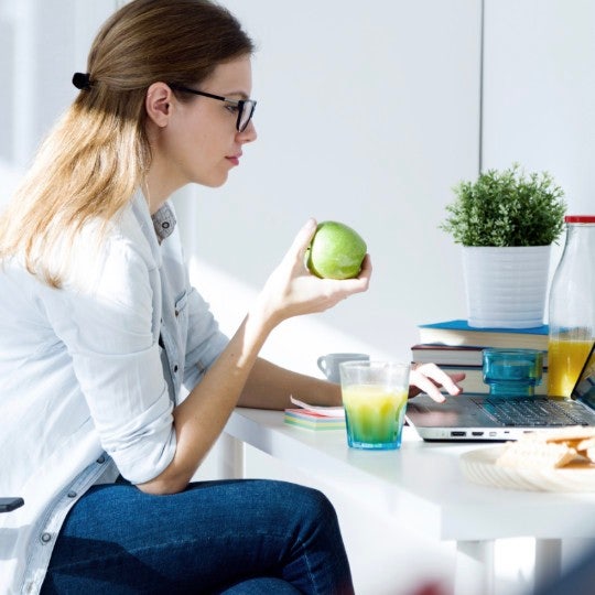 woman working home eating