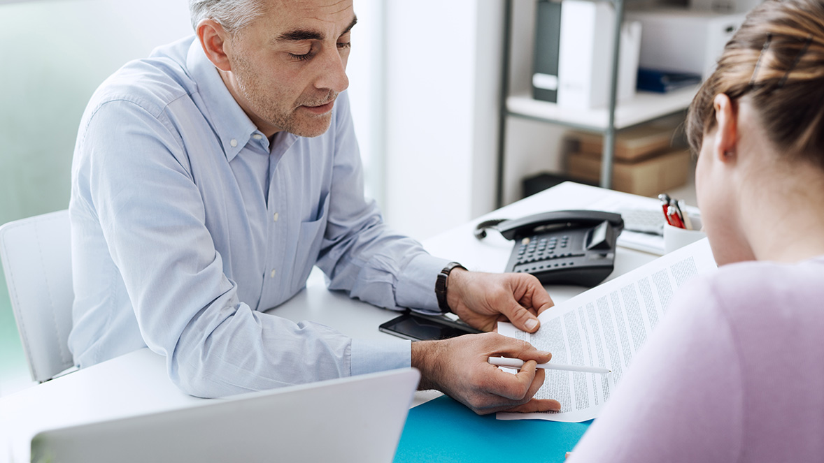 man explaining a form at work