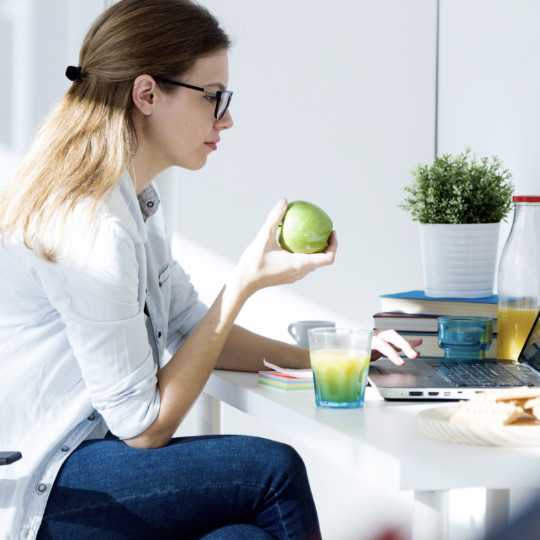 woman working home eating