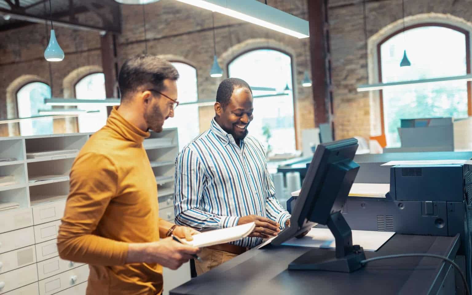 Men working at computer